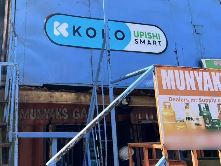 A KOKO agent shop front with KOKO Upishi Smart signage above a gas dealer's shop.